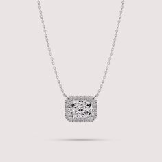 Elevate your style with this exquisite necklace crafted from 14K white gold. The centerpiece features a radiant cut solitaire lab diamond encircled by a dazzling halo of smaller lab diamonds, creating a mesmerizing cluster effect. With its timeless elegance and sophisticated design, this necklace is sure to become a cherished piece in your jewelry collection. ✤𝐃𝐢𝐚𝐦𝐨𝐧𝐝 𝐃𝐞𝐭𝐚𝐢𝐥𝐬 Color: F Clarity: VS1 Shape: Radiant Cut Carat Weight: 1 CT Approx. (5*7 MM) Type: Lab Diamond ✤ 𝐒𝐢𝐝𝐞 𝐃𝐢𝐚𝐦𝐨𝐧𝐝 𝐃𝐞𝐭𝐚𝐢𝐥𝐬 Color: F Clarity: VS1 Shape: Round Carat Weight: 0.12 CT Type: Lab Diamonds ✤Metal 𝐃𝐞𝐭𝐚𝐢𝐥𝐬 Metal Purity: Solid 14K Gold Metal Tone: Yellow, White, Rose Stamp/Hallmark: Yes Jewelry Certificate: Free of Cost with Listed Design Chain Length: 16″ inch Diamond Cluster Necklace, Cluster Necklace, Necklace Craft, Radiant Cut, Fine Jewellery Necklace, Diamond Cluster, Sophisticated Design, White Rose, Lab Diamonds