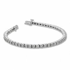 A classic look just for her, this 1/2 ct. t.w. diamond tennis bracelet in sterling silver complements every look and every occasion. Fashioned in sleek sterling silver Round diamonds - each artfully set to enhance size and sparkle - line this timeless tyle. Look great solo or layered with her other favorite bracelets Captivating with 1/2 ct. t.w. of diamonds This 7.25-inch bracelet secures with a tongue and groove clasp. Diamond Tennis Bracelet, Tongue And Groove, Tennis Bracelet Diamond, Tennis Bracelet, Sophisticated Style, Sterling Silver Bracelets, Classic Looks, Round Diamonds, Timeless Design