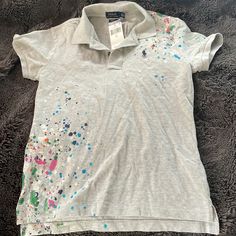 Polo Ralph Lauren Grey Splatter Paint Shirt With Tags Casual Short Sleeve Paint Splatter Top, Casual Short Sleeve Tops With Paint Splatter, Casual Paint Splatter Tops For Summer, Casual Paint Splatter Top For Spring, Casual Spring Tops With Paint Splatter, Spring Short Sleeve Tops With Paint Splatter, Spring Paint Splatter Short Sleeve Tops, Multicolor Paint Splatter Cotton Top, Paint Splatter Shirt