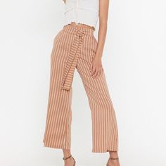 By Eight Paris From Nasty Gal. Never Worn, Excellent Condition. Wide Leg, Tie Front, High Waisted, Stretchy Waist Band. Pockets At Each Side. Light Brown With White/Cream Stripes. Blue Pants Shown For Fit. 10% Off 2+ Items When You Bundle! Reasonable Offers Always Welcome :) Please Keep In Mind Poshmark Takes A $2.95 Fee For Sales Under $15 And A 20% Fee For Sales Of $15 Or More White Summer Pants With Tie Waist, White Wide-leg Pants With Tie Waist, Spring Tie Waist Bottoms For Brunch, Spring Brunch Bottoms With Tie Waist, High Waist Beige Bottoms For Brunch, White High-waisted Pants With Tie Waist, Chic Tie Waist Bottoms For Brunch, White Tie Waist High-waisted Pants, White Tie Waist Trousers