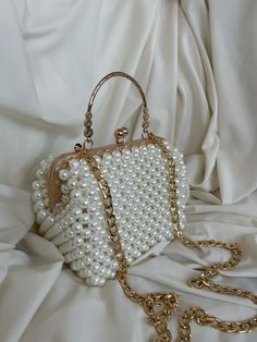 🌟 Elevate your style with this exquisitely crafted handbag adorned with pearl details. 🌟 Handcrafted with care, this bag is designed to add a touch of sophistication to every moment. The elegance of the pearl embellishments sets this bag apart, transforming it into a unique accessory. 🌸 Why Choose This Bag? 🌸 More than just an accessory, this bag is an opportunity to reflect your style and grace. Whether for a special event or to enhance your daily chic, this pearl-adorned bag complements every outfit perfectly. Consider gifting it to your loved ones to make their special moments even more meaningful. 🌟 Bag Size: 18x15 cm 🎁 Package Includes: 1 Handmade Bag with Pearl Details Carefully packaged, suitable for gifting 💌 Fast and Secure Delivery: Our products are meticulously packaged a Luxury Shoulder Bag With Pearl Handle For Evening, Cheap Shoulder Bag With Pearl Handle For Events, Luxury Pearl Embroidery Shoulder Bag For Party, Luxury Pearl Embroidered Shoulder Bag For Formal Occasions, Luxury Pearl Bags For Formal Occasions, Affordable Event Shoulder Bag With Pearl Handle, Cheap Formal Evening Bag With Pearl Handle, Luxury Pearl Evening Bag For Formal Occasions, Cheap Clutch Shoulder Bag With Pearl Handle