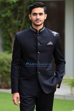 This striking black Indo-Western suit features intricate embroidery on the collar and shoulder, giving it a regal touch. Designed for modern grooms or formal events, the suit combines elegance and sophistication with a sleek silhouette. Perfect for those who want to stand out with understated luxury. Nehru suit 2 Pc (Jacket, Pants). Made in Black color pure polyester fabric. All sizes shown are US Sizes for men Care Instructions : Dry Clean Only Designer Black Tuxedo For Groom, Black Tuxedo For Groom Festive Occasion, Festive Black Tuxedo For Groom, Traditional Black Tuxedo For Groom, Elegant Black Unstitched Suit For Groom, Traditional Black Groom Tuxedo, Black Formal Sets With Intricate Embroidery, Black Sets With Intricate Embroidery For Formal Events, Black Sets With Intricate Embroidery For Formal Occasions