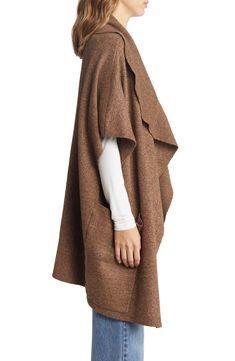 Roomy pockets lend convenience to this oversized ruana knit in a flowy silhouette with clean edges. 33 1/2" x 23 1/2" 52% viscose, 28% polyester, 20% polyamide Dry clean Imported Versatile Oversized Knit Outerwear, Fall Workwear Poncho Cape, Casual Cape For Fall Workwear, Casual Fall Cape For Workwear, Casual Workwear Cape For Fall, Casual Fall Workwear Cape, Oversized Poncho For Layering, Oversized Shawl Poncho For Layering, Oversized Cape Cardigan For Fall