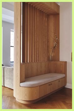 a wooden bench sitting in the middle of a room