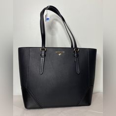 New With Tag. Micheal Kors Tote Black. The Tote You'll Want To Take Everywhere. This Luxe Leather Style From Michael Kors Offers A Spacious Silhouette To Accommodate Your Essentials And Shiny Gold-Tone Hardware For A Polished Look. Large Sized Bag; 17-1/2"W X 11-1/2"H X 6"D (Width Is Measured Across The Bottom Of Handbag) Approximately Top Handles Zip Closure Interior: 1 Back Zip Pocket, 2 Back Slip Pockets, 4 Front Slip Pockets Exterior: Gold-Tone Exterior Hardware, Logo Plaque Detail, 1 Back S Designer Pebbled Leather Bag For Everyday Use, Designer Everyday Pebbled Leather Bags, Black Pebbled Leather Bag For Daily Use, Black Pebbled Leather Travel Bag, Rectangular Pebbled Leather Bag For Shopping, Classic Bags With Branded Hardware For Daily Use, Elegant Bags With Pebbled Leather And Leather Handles, Black Pebbled Leather Bag With Removable Pouch, Black Pebbled Leather Tote Shoulder Bag