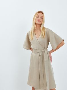 "MARY is a short sleeve midi linen wrap dress. DETAILS - Wrap robe - Self tie belt - Dolman style sleeves - Knee length - 100% lightweight European linen fabric - Cut and sewn to order just for you in our studio COLOR - Undyed, you can also choose other colors above - Fabric samples are available here https://www.etsy.com/listing/586569696/linen-fabric-samples SIZING & FIT - Relaxed fit - True to size - Measurements taken from a size S - Model is 5'8\" / 173cm and wearing a size S CARE FOR LINEN - Machine wash up to 30ºC/86ºF gentle cycle - Lay flat to dry or tumble dry low - Warm iron if needed - Do not bleach SIZE GUIDE Size conversion guide Size XS (US 0-2, IT 36-38, UK 4-6, Japan 3-5, France 32-34) Size S (US 4-6, IT 40-42, UK 8-10, Japan 7-9, France 36-38) Size M (US 8-10, IT 44-46, U Wrap Dress Linen, Summer Wrap Dress With Kimono Sleeves And Belted Waist, Summer Wrap Dress With Kimono Sleeves And Belt, Beige Wrap Dress With Tie Waist, Linen Belted V-neck Midi Dress, Belted Linen V-neck Midi Dress, Belted V-neck Linen Midi Dress, Belted Linen Wrap Dress, Spring Short Sleeve Belted Linen Dress