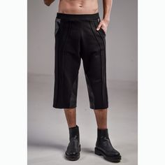 Introducing our Apex Shorts/ Pants -- a fusion of style and comfort for the modern urbanite. Crafted from stretchy cotton lycra on elastic, these trousers offer a comfortable fit that moves with you. The pinch stitch vertical lines running through the pants create a sleek and edgy look, perfect for urban fashion enthusiasts. Designed with front pockets and faux leather parts, these pants combine functionality with street style. Their loose below knee fit ensures all-day comfort, making them idea Urban Cargo Pants For Fall, Fitted Black Cargo Pants For Summer, Black Urban Pants For Summer, Techwear Black Bottoms For Alternative Fashion, Urban Black Pants For Alternative Fashion, Black Hip Hop Pants For Summer, Edgy Streetwear Bottoms With Hip Pockets, Black Streetwear Bottoms For Spring, Black Hip Hop Bottoms For Spring