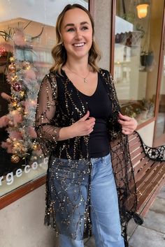 Blonde girl wearing a black and gold sequin kimono over a black tank top with light denim jeans. Sequin Kimono Outfit, The Dalles Oregon, Rhinestone Jacket, Sequin Kimono, Facebook Black, Kimono Outfit, Criss Cross Sandals, Bohemian Women, Columbia River Gorge