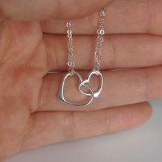 Two hearts necklace + Sterling silver chain (1.4mm) + Sterling silver double heart charm (13x22mm) + Sterling Silver spring clasp + 2 inch sterling silver extender * Every item comes in a pretty gift box * Please contact me for custom sizes or designs Silver Heart Necklace With Adjustable Chain For Mother's Day, Nickel-free Double Heart Sterling Silver Necklace, Silver Heart Charm Necklace For Birthday Gift, Silver Open Heart Necklace For Birthday, Silver Open Heart Necklace For Birthday Gift, Silver Sterling Heart Necklace For Birthday, Sterling Silver Heart Charm Necklace For Anniversary, Silver Sterling Silver Heart Necklace For Birthday Gift, Nickel-free Double Heart Sterling Silver Charm Necklace