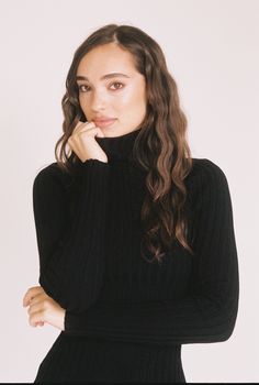 A fall staple - a classic black turtleneck dress that is both sleek and refined. Black High Neck Turtleneck For Work, Sleek Black Long Sleeve Turtleneck, Black Classic Funnel Neck Turtleneck, Sleek Funnel Neck Turtleneck For Winter, Elegant High Neck Turtleneck For Fall, Classic Black Turtleneck For Fall, Elegant Black Turtleneck For Fall, Elegant Fitted Fall Turtleneck, Sleek Black Turtleneck For Winter