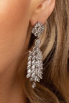 The SADIE statement earrings feature an exotic and unique look that can be worn for any occasion. The design gives it a 3D look to make the earrings refined and enduring. These will surely be the go to earrings in your high style collection and big event! Handcrafted Highest Quality Swarovski / Cubic Zirconia Platinum plated Guards against scratches and tarnish. approximate size 2.5" length 1" width Nickel free Free Shipping in USA Luxury Pierced Earrings For Party, Glamorous Formal Bridal Earrings, Luxury Silver Chandelier Earrings For Party, Elegant Pierced Chandelier Earrings For Party, Luxury Drop Linear Earrings For Party, Glamorous Dangle Chandelier Earrings With Elegant Design, Glamorous Pierced Earrings For Formal Events, Luxury Linear Drop Earrings For Party, Luxury Teardrop Chandelier Earrings For Party