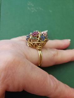 "Beautiful, unique, outrageous vintage18K multi stone ring. There is no karat stamp, but has been tested as 18K. It weighs 14.8 grams, and is set with the following approximate weights of stones: .30 ctw genuine emeralds, .59 ctw genuine sapphires, and .70 ctw genuine rubies. It is between a size 7 1/2 and 8. It has \"bumps\" inside the ring which leave a small gap, when measuring it in a mandrel. There is one flaw in the ring. There is a missing emerald, due to a broken prong. I have this area Vintage Gold Multi-stone Cluster Ring, Gold Multi-stone Cluster Ring Collectible, Multicolor Jeweled Rings For Anniversary, Vintage Multicolor Rings For Jewelry Making, Antique Ring Box, Platinum Wedding Band, White Gold Wedding Bands, Platinum Wedding, White Gold Wedding