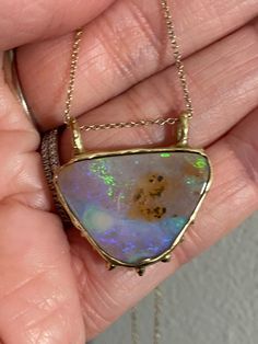 Australian Boulder Opal pendent. Made in 18kt gold chain not included.  Handmade, please allow time for workmanship and mail delivery.  Due to the nature and handmade item no piece will be the same. Please message seller if you want multiples. Prefect Gifts for loved ones, Gifts for Her, Gifts for mom this Holiday season or any special occasion. Although opals can be been found all around the world, there are only a few major sources of this gemstone. Australian opals account for 95% of the worl Luxury Adjustable Opal Jewelry, One Of A Kind Pendant Fine Jewelry, One Of A Kind Fine Jewelry Pendant, Exquisite Handmade Yellow Gold Necklace, Collectible Yellow Gold Necklaces With Gemstone, Elegant Opal Necklace With Large Pendant, Unique Yellow Gold Collectible Jewelry, Unique Yellow Gold Necklace With Cabochon, Artisan Yellow Gold Jewelry Gift