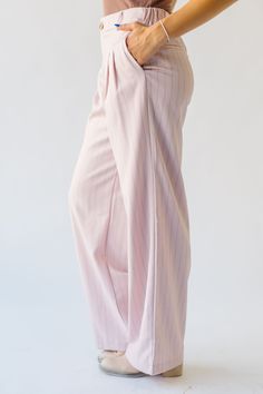 Introducing the Hopwood Pinstripe Wide Leg Trouser, in a soft pink color. These trousers are perfect for any occasion, with a quirky and playful design. The wide leg and pinstripe pattern add a touch of fun and uniqueness. Say goodbye to boring trousers and hello to the Hopwood! Details self/lining: 98% polyester + 2% spandex Fabric Care Guide Here Sizing & Fit Measurements are approximate and taken while laying flat across the front. Not doubled. small: waist = 13"; length = 42"; inseam = 31.5“ Spring Wide Leg Pants With Vertical Stripes, Pinstripe Wide Leg Pants For Spring, Spring Wide-leg Pants With Vertical Stripes, Pinstripe High-waisted Pants For Spring, Spring Pinstripe Trousers, Pinstripe High Waist Pants For Spring, Chic Pink Wide Leg Loungewear Pants, Chic Striped Wide Leg Pants For Loungewear, Pink High Waist Wide Leg Pants For Loungewear