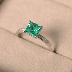 This ring features a 6*6mm princess cut lab emerald and sterling silver finished with rhodium. Customization is available. It is made by hand, and it will take about 7 days to finish the ring after your payment is completed. Main stone: lab emerald Main stone weight: Approx 1.10 ct Metal type: sterling silver finished with rhodium Accent stone: cz Customization is available, I also can make it with 14k solid gold (white or yellow or rose) and diamond accent stone, just feel free to contact me. I Green Princess Cut Diamond Ring, Green Princess Cut Diamond Ring Fine Jewelry, Princess Cut Emerald And Diamond Promise Ring, Princess Cut Diamond Emerald Ring For Promise, Green Princess Cut Diamond Ring In Fine Jewelry Style, Fine Jewelry Green Princess Cut Diamond Ring, Green Princess Cut Diamond Ring With Accent Stones, Green Diamond Ring With Princess Cut And Accent Stones, Brilliant Princess Cut Emerald Ring For May Birthstone