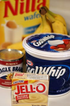 yogurt, jelly and bananas on a counter