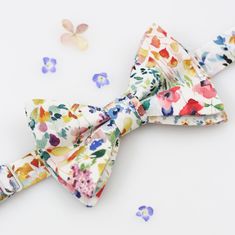 We present to you an exclusive bow tie with a flower, the ideal accessory for any special occasion! Featuring an elegant pattern of delicate meadow watercolor flowers on a soft, pastel white background, this bow tie will add a touch of sophistication and charm to any man. The price is for 1 piece of men's bow tie. You can choose the number of bow ties in the basket. If you would like a handkerchief for your jacket along with the bow ties, do not hesitate to write to me. Elegant men's wedding bow Floral Bowtie, Flowers For Men, Pastel White, Floral Bow Tie, Kids Bow Ties, Bow Tie Wedding, Elegant Pattern, Elegant Man, Wedding Bows