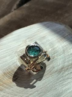 Moonbeams Ring | Etsy Modern Green Jewelry With Accent Stones, Artisan Jewelry With Gemstone Accents For Anniversary, Elegant Apatite Rings As A Gift, Elegant Apatite Rings For Gifts, Unique Emerald Rings With Gemstone Accents, Unique Green Jewelry With Accent Stones, Unique Multi-stone Emerald Jewelry, Green Blue Topaz Jewelry With Accent Stones, Modern Emerald Jewelry With Accent Stones