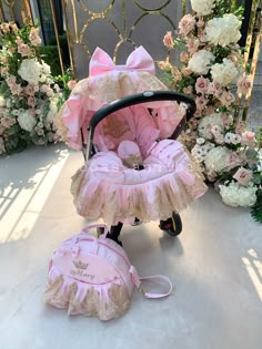 a baby stroller with pink ruffles and bows