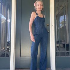 the best overalls ever the end yes seriously. [drops mic]. iconic h.i.s denim overalls for all my boho babes out there. get them before they're gone! buckle back at waist to cinch for the perfect fit. adjustable shoulder straps. straight legs. slat pockets at hips. low back. can be worn with or without a shirt under. in great vintage condition. please refer to photos as they are part of the description. considered a modern day size xsmall. measurements are as follows: pit to pit: 15" waist: 26"/can be made smaller with the back tie hips: 38" rise: 11" inseam: 32" Dark Wash Fitted Wide Leg Jumpsuits And Rompers, Dark Wash Fitted Wide Leg Jumpsuit, Fitted Dark Wash Wide Leg Jumpsuits And Rompers, Fitted Wide-leg Dark Wash Jumpsuits And Rompers, Fitted Wide Leg Dark Wash Jumpsuit, Fitted Wide Leg Overalls With Pockets, Dark Wash Fitted Overall Jumpsuits And Rompers, Fitted Wide-leg Denim Blue Overalls, Fitted Dark Wash Jumpsuits And Rompers Overall