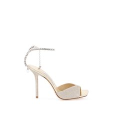 Jimmy Choo Saeda Sandals With All-Over Glitter And Characterized By A Crystal Strap With Drop Charm. Laminated Leather Insole And Leather Sole. Materal: 100% Tr, 100% Calf Leather. Made In: Italia. Color: Gold. Collection: Fall - Winter 2023. Sku: Saeda Sandal 100 Gjv. Heel Height: 10 Cm. Modecraze Is An Online Platform That Offers The Best Designer Products From Europe To Customers All Over The World. Our Exclusive Partnerships With European Retailers Ensure That We Curate A Wide Selection Of A Luxury Sparkling Sandals With Ankle Strap, Luxury Sparkling Sandals For Gala, Luxury Open Toe Sparkling Sandals, Luxury Formal Sandals With Glitter, Luxury Sparkling High Heel Sandals, Luxury Sparkling Open Toe Sandals, Luxury Glitter Sandals For Formal Occasions, Luxury Sparkling Ankle Strap Sandals, Luxury High Heel Sparkling Sandals