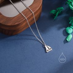 Sailing Boat Pendant Necklace in Sterling Silver, Silver or Gold, Boat Necklace, Sterling SIlver Boat Pendant Dimension:  Chain length: 41cm plus 5cm extension chain.   Production method:  Small Batch Lost-wax casting. Stamp: 925 SRS ( Our brand initials for Silver Rain Silver).  Materials and Care: These are made with solid sterling silver and coated with precious metal Rhodium and with the option of 18ct yellow gold. When not wearing, please keep in a sealed plastic bag.  Packaging: All our je Sailing Boat, Wax Casting, Lost Wax Casting, Lost Wax, Bag Packaging, Velvet Bag, Necklace Sterling Silver, Small Batch, Plastic Bag