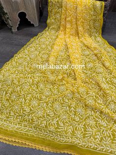 Beautiful and lightweight Chikankari hand embroidered geoDupatta with crochet lace. Luxury Bollywood Dupatta With Chikankari Embroidery, Luxury Chikankari Embroidery Shawl, Yellow Semi-stitched Chikankari Embroidered Fabric, Yellow Cotton Dupatta With Floral Embroidery, Bohemian Mulmul Dupatta With Chikankari Embroidery, Bohemian Dupatta With Chikankari Embroidery, Yellow Georgette Dupatta With Chikankari Embroidery, Yellow Georgette Dupatta With Intricate Embroidery, Intricate Embroidery On Mulmul Fabric