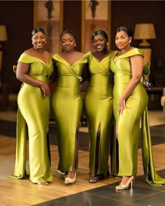 three women in lime green dresses posing for the camera with their arms around each other