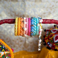 Bohemian Beaded Bangle Bracelet For Wedding, Bohemian Embroidered Jewelry For Wedding, Handmade White Bangle For Parties, Bohemian Embroidered Bracelets For Weddings, Bohemian Handmade Beaded Bracelets For Celebration, Handmade Bangle For Celebrations, Adjustable Multicolor Wedding Bracelet, Bohemian Bangle Bracelet For Celebration, Yellow Bohemian Bracelets For Festive Occasions