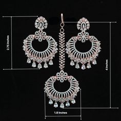 Luxury look American Diamond Chandbali Earrings tikka set from the house of IndianDesigns(Z). Rose Gold plated Earrings and maang tikka set studded with studding high quality American diamond and CZ color stones. Luxury Traditional Chandbalis With Tilla, Luxury American Diamond Danglers For Festive Occasions, Luxury Cutdana Chandbalis For Celebration, Luxury Women's Danglers For Diwali, Luxury Chandbali Danglers For Party, Luxury Chandbali Tikka With Intricate Design, Luxury Silver Tikka In Temple Jewelry Style, Diamond Chandbali Earrings, Diamond Chandbali