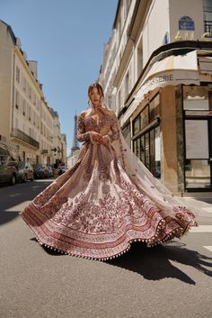 Maroon & Ivory Lehenga Set captivates with handcrafted embroidery on raw silk. The net and raw silk blouse features a unique silhouette, complementing the rich textures of the ensemble. Paired with a delicate net dupattaFrom Jigar Nikita’s 11:11 In Paris collection DELIVERY TIMEPlease allow 8-12 weeks for your outfit to arrive. FABRIC DETAILSLehenga - Raw silk, Blouse - Net and Raw Silk, Dupatta - Net Professional cleaning only. Maroon Bridal Lehenga, Indian Bridal Couture, Ivory Lehenga, Wedding Bride Dress, Raw Silk Blouse, Indian Wedding Bride, Hand Embroidery Work, Indian Bridal Lehenga, Elegant Blouse Designs