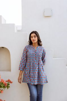 🌷  JAYALINI Add a splash of colour to your wardrobe with our Jayalini Tunic in vibrating floral motifs. Jayalini was created for a comfortable loose fit, and decorated with traditional hand block prints. Sizings: Size S:   Shoulders 38cm - 14.9" Bust  92cm - 36.2" Length approx. 72cm - 28.3" Size M:   Shoulders 40cm - 15.7" Bust  102cm - 40.1" Length approx. 72cm - 28.3" Size L:   Shoulders 42cm - 16.5" Bust  108cm - 42.5" Length approx. 72cm - 28.3" Size XL: Shoulders 43cm - 16.9" Bust  112cm Summer V-neck Kurta With Block Print, White Bohemian, Splash Of Colour, Tunic Shirt, Cotton Fabrics, Floral Motifs, Ethical Fashion, Womens Clothing Tops, Color Splash