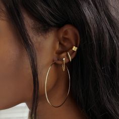 Modern and edgy, these suspender earring is worn like a stud earring but it appears to hug your whole ear lobes. Can be worn on second hole for those with larger ear lobes. Gold Vermeil Hypoallergenic, lead and nickel free Inside Length: 16mm(first hole) or 13mm(second hole)) Thickness: 1.6mm Comes with butterfly earring backs #E569-G Everyday Pierced Ear Cuff, Everyday Round Ear Cuff With Ear Wire, Everyday Single Hoop Plug Earring, Gold Metal Piercings, Trendy Everyday Pierced Wrap Earrings, Minimalist Single Hoop Plug Earring, Trendy Tarnish-resistant Everyday Piercings, Trendy Adjustable Drop Cartilage Earrings, Modern Internally Threaded Adjustable Earrings