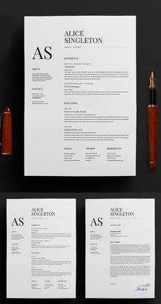 two resumes, one with an orange pen and the other with black ink