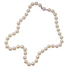 This is a stunning vintage pearl necklace measuring 18 inches in length and composed of 55 9mm-9.4mm round cultured Akoya pearls and finished with an 18K white gold beaded ball clasp which glitters with a multitude of small full-cut diamonds that total approximately .50 carats. The necklace was purchased in the United Kingdom but bears no hallmarks. It's very well-made and remains on its original silk, which still appears sturdy. I believe the necklace dates to the 1980s. Cultured Akoya pearls over 8mm in diameter are the most coveted of all Akoya pearls because fine ones are difficult to achieve. The longer a pearl remains inside the oyster the thicker the nacre and larger it grows but the greater the opportunity for any number of variables to come along and spoil the pearl. These large 9 Luxury Beaded Akoya Pearl Necklace, Luxury White Gold Necklace With Round Beads, Luxury Vintage Akoya Pearl Jewelry, Vintage Pearl Necklace, Akoya Pearl Necklace, Beaded Ball, Pearl Necklace Vintage, Pearl And Diamond Necklace, Small Necklace