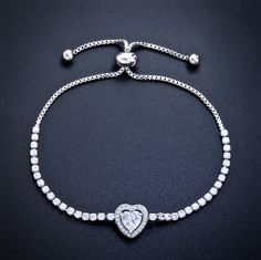 Delicate and elegant, this adjustable heart bracelet will add a touch of sophistication to any wedding gown or formal ensemble. Adorned with heart-shaped cubic zirconia that captures the light from every angle with a perfectly translucent appeal, the bracelet is rhodium / rose gold / yellow gold plated for a flawless finish which perfectly enhances the intricate detailing and conveys a modern take on old elegance. The bracelet measures 0.4" (approx. 1cm) at the widest point, and the adjustable c Bridal Bracelet, Heart Bracelet, Heart Jewelry, Silver Rose Gold, Gold Yellow, Wedding Gown, Wedding Jewelry, Heart Shapes, Cubic Zirconia