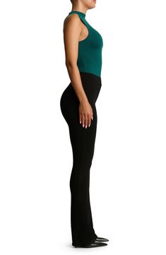 Sleek all-in-one style and breathable stretch jersey makes this thong bodysuit a svelte option for all your warm-weather plans. This form-fitting essential is made from the label's signature NW fabric, which is double lined, has four-way stretch, comfortable compression and a subtle crepe texture. Snap closure Funnel neck Sleeveless Lined 95% viscose, 5% elastane Hand wash, line dry Imported Stretch Bodysuit With Built-in Bra, Fitted Seamless Bodysuit For Night Out, Seamless Fitted Bodysuit For Night Out, Stretch Bodysuit With Lined Body For Loungewear, Stretch Bodysuit With Built-in Bra And High-cut Leg, Sleek Stretch Bodysuit For Loungewear, Second-skin Elastane Bodysuit For Loungewear, High Cut Stretch Smoothing Bodysuit, Smoothing Bodysuit For Night Out