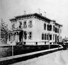 an old black and white photo of a large building