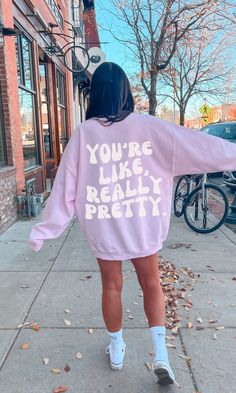 "This unique sweatshirt is made with quality fabric that is soft to the touch.. The design is simple, yet eye-catching, with a bold font that reads \"You're Like, Really Pretty.\". Perfect for any season, this sweatshirt is sure to become your favorite go-to item! Material & Care -50% cotton, 50% polyester -Medium-heavy fabric -Loose fit -Sewn-in label -Runs true to size -Wash Inside Out  -Gildan 18000 - Size Up For Oversized Fit Any questions just ask :) xo, Bobbi" Trendy Long Sleeve College Sweatshirt, Oversized Pink Sweatshirt For Everyday, Trendy Long Sleeve Sweater With Text Print, Trendy Relaxed Fit Sweater For College, Everyday Long Sleeve Graphic Sweatshirt, Relaxed Fit Letter Print Trendy Sweater, Trendy Relaxed Fit Sweater With Letter Print, Relaxed Fit Letter Print Sweater, Trendy Cotton College Sweater