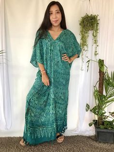 Hand Stamped Batik Dyed Long Kaftan Dress in teal green color hues. This Long Kaftan Maxi Dress made of soft, delicate and lightweight rayon with 2 hidden pockets on each side. Its so convenience to wear a dress with 2 big pockets to store your phone, keys and any other personal belongings without V-neck Batik Print Festival Dress, Green V-neck Batik Print Dress, Spring V-neck Kaftan With Batik Print, Bohemian V-neck Maxi Dress With Batik Print, Bohemian V-neck Dress With Natural Dye, Green V-neck Free Size Kaftan, Green Batik Print Kaftan For Festival, Green V-neck Free-size Kaftan, Hippie V-neck Free Size Kaftan