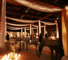 an image of a banquet hall setting with candles