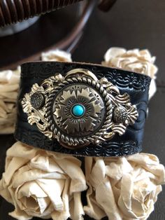 "⚠️⚠️⚠️SHIPPING ALERT⚠️⚠️⚠️ I will be away from the studio through August 22. Orders placed after August 10 will NOT ship out until Thursday, August 25. Shipping will be delayed and will resume Thursday, August 25. Please keep this in mind when placing your order. Thank you for your patience Country leather bracelet cuff, western jewelry New genuine black distressed tooled leather 1 1/2\" strap has been adorned with an oval southwestern silver concho with faux turquoise which sets on an antiqued Adjustable Western Leather Bracelet For Festivals, Vintage Concho Leather Bracelet For Festival, Adjustable Western Cuff Bracelet For Festivals, Vintage Leather Concho Bracelet For Festival, Adjustable Western Style Cuff Bracelet For Festivals, Handmade Western Style Cuff Bracelets, Adjustable Western Style Festival Cuff Bracelet, Western Style Adjustable Cuff Bracelet For Festivals, Southwestern Leather Bracelet With Concho For Gifts