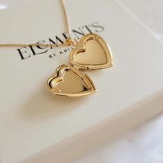 Heart locket necklace. Wear it on it's own or layer it. * we are not able to print your photo at the moment. you can cut out your own picture or order it online from site like postsnapPendant details: * Material: non tarnish gold filled* Measurements: 1.1' H 0.75' WChain: 18K gold filledComes in our gift ready packaging: vegan leather pouch for safe jewelry storing and branded box Gold Heart Locket Necklace, Gold Heart Locket, Heart Locket Necklace, Heart Locket, Locket Necklace, Leather Pouch, Gold Heart, Everyday Jewelry, Heart Of Gold