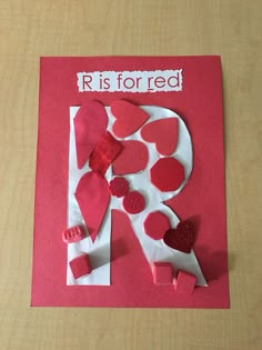 the letter r is for red made out of paper with hearts and glue on it