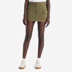 Your favorite cargo-in skirt form. With an ultra-flattering mid-rise and an above-the-knee length cut, our mini cargo skirt features oversized patch pockets and an effortless '90s style.Front Style: Flat FrontFeatures: Fly FrontClosure Type: Button, ZipperClosure Location: FrontPockets: 2 Cargo Side PocketsRise: Mid RiseApparel Length: 13 InchesFiber Content: 100% CottonLining: UnlinedSkirt Length: Short LengthCare: Machine Wash, Tumble DrySkirt Type: Denim SkirtsCountry of Origin: Imported Skirts Denim, Denim Skirt Women, Denim Skirts, Cargo Skirt, 90s Style, Green Skirt, Above The Knee, Denim Skirt, Levi's