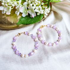 Purple Pearl Bracelet - Baroque Pearl Bracelet - Purple Bracelet - Violet - Lilac - Pastel Pearl Bracelet Item Details: ⭐ This bracelet is so simple yet on point, in trend and chic. It's made with pastel purple jade beads and baroque pearls. Another option is made with beautiful shiny purple glass beads. ⭐ This bracelet is 18cm long. You can request your own desired length if this is not the length you like.  ⭐ The bracelet is made with 18k gold-plated gold chain 💻😊 P.S. If this length is not Lavender Bracelets With Spacer Beads For Gift, Lavender Bracelets With Spacer Beads As Gift, Pearl Bracelets With Spacer Beads For Gifts, Lavender Beaded Crystal Bracelet As A Gift, Lavender Beaded Crystal Bracelet For Gifts, Lavender Beaded Bracelets With Round Beads As Gift, Handmade Pearl Bracelets With Round Beads, Purple Beaded Pearl Bracelets, Lavender Bracelet With Spacer And Round Beads