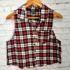 Super Cute! Wild Fable Sleeveless Flannel Top In Size Medium. Red And Black Flannel. Front Pocket And Button Front. Nwot. Thanks For Looking Casual Plaid Sleeveless Vest, Sleeveless Tops With Buttons For Fall, Red Sleeveless Vest With Buttons, Casual Plaid Sleeveless Tank Top, Sleeveless Tops With Button Closure For Fall, Red Sleeveless Top With Button Closure, Plaid Cotton Sleeveless Tank Top, Casual Plaid Vest Top, Fall Sleeveless Tank Top With Button Closure