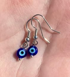 Dainty, handmade, evil eye, glass bead earrings with silver or gold earring hooks, posts, or hoops. All of my jewelry is hypoallergenic and waterproof. Dainty Silver Evil Eye Jewelry, Hoop Earrings Diy, Earring Beads, Handmade Evil Eye, Boone Nc, Glass Bead Earrings, Cultural Appropriation, Evil Eye Earrings, Dope Jewelry