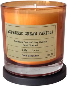 a candle that is sitting on top of a wooden stand and has a label reading espresso cream vanilla