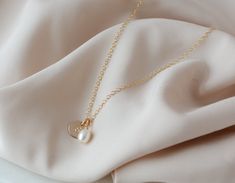 Pearl Initial Necklace alphabet mother of pearl letter necklace gold initial birthday gift dainty necklace delicate elegant gift for her. A pearls necklace is a timeless, classic and elegant gift that will always be in style. The perfect birthday gift for Mom, Grandma or anyone special in your life.  This pearl necklace is sure to please anyone on your list. If you're looking to get something special for someone who likes to keep it classy, this pearl necklace makes a great choice. ⭐︎ Details: ♡ Dainty Charm Necklaces With Pearl Initial Pendant, Dainty Pearl Charm Necklace With Initial Pendant, Personalized Gold Pearl Necklace For Wedding, Elegant Initial Pendant Charm Necklace For Wedding, Dainty Pearl Necklace With Initial Pendant Gift, Elegant Initial Necklace With Birthstone For Mother's Day, Elegant Initial Necklace With Delicate Chain For Wedding, Personalized Dainty Pearl Necklace For Anniversary, Elegant White Charm Necklaces As Gift For Mom